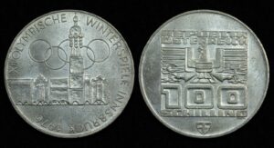 Купить Австрия 100 шиллингов 1975 год XII зимние Олимпийские Игры, Инсбрук 1976-Здания и Олимпийская эмблема (№244)